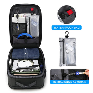 Black hardshell backpack with a moulded front panel and an external USB port