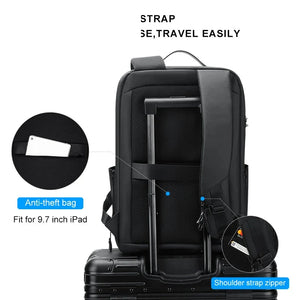 Black hardshell backpack with a moulded front panel and an external USB port