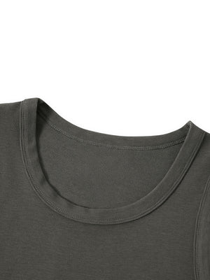 Close-up of the round neckline, bound in the same rib and pressed flat against the body