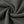 The ribbed fabric twisted to show its texture, a 300 gsm blend with a fine vertical rib