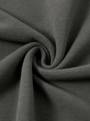 The ribbed fabric twisted to show its texture, a 300 gsm blend with a fine vertical rib