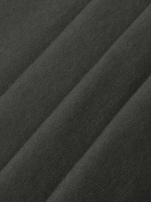 Folds of the grey rib laid across each other, showing how the knit stretches and recovers