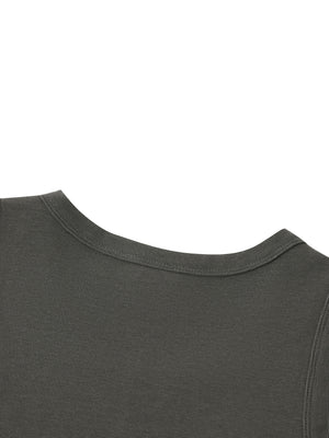 Close-up of the shoulder where the neck and armhole bindings meet in a single seam