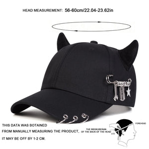 Black baseball cap with devil horns and metal rings on the brim