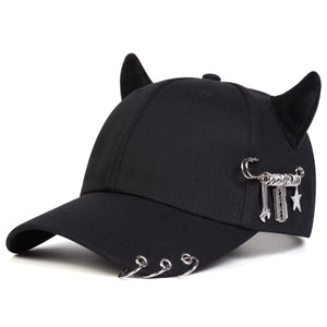 Black baseball cap with devil horns and metal rings on the brim
