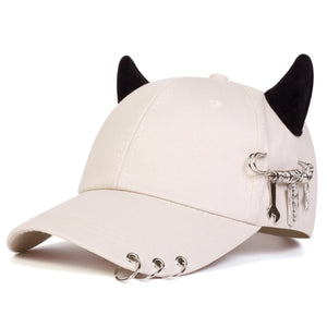 Black baseball cap with devil horns and metal rings on the brim