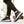 Man walking in Black knit mesh sneakers with red stripes and black joggers, side view