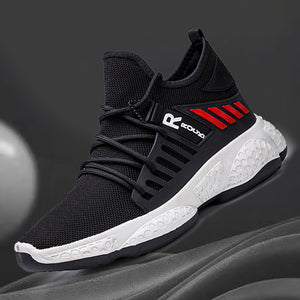 Black mesh techwear sneaker on a dark background, sock collar, red stripes and white sole