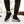 Man wearing Black knit mesh sneakers and black joggers, front view of both shoes