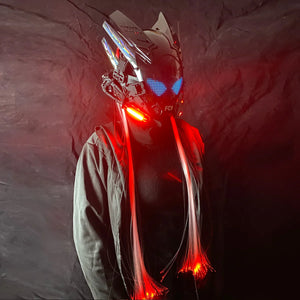 Large Screen Cyberpunk Helmet worn front on, blue pixel eyes with red fibres against a dark cloth