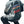 Back of the grey layered sleeve baseball bomber jacket with the large retro print, man seated