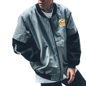 Grey layered sleeve baseball bomber jacket on a man, front view with black sleeves and ribbed collar