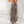 Sand tree camouflage baggy cargo pants worn low with a white cami, front view with white sneakers