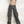 Gray camouflage low rise cargo pants, front view of the zip fly, hip pockets and flap side pocket