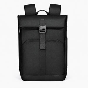 Magnetic Clasp Techwear Backpack in black above a flat lay of a 16 inch laptop and travel essentials