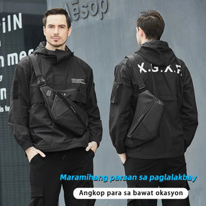 Slim black sling bag with a magnetic clasp and a wide chest strap