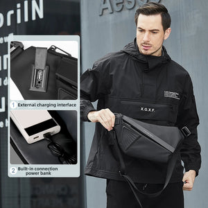 Slim black sling bag with a magnetic clasp and a wide chest strap