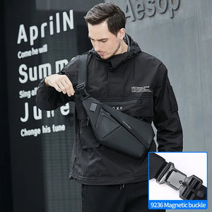Slim black sling bag with a magnetic clasp and a wide chest strap