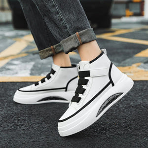 A pair of high-top Casual Techwear Shoes with black and white color scheme, featuring an adjustable velcro strap and a futuristic air cushion sole.