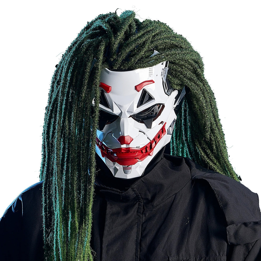 Person wearing a white mask with red accents and green dreadlocks on a white background