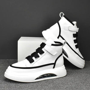 A pair of high-top Casual Techwear Shoes with black and white color scheme, featuring an adjustable velcro strap and a futuristic air cushion sole.