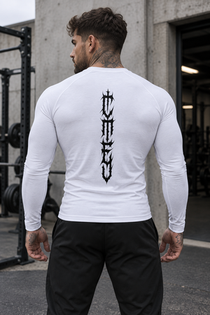 Back view on a man in a gym, black gothic lettering running down the spine of the white shirt