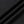 Black jacquard mesh fabric of the gym shirt in soft folds, with its small dotted check pattern
