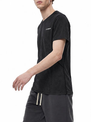 Man walking in the black jacquard mesh gym shirt, three-quarter view with the CYBER print on the chest