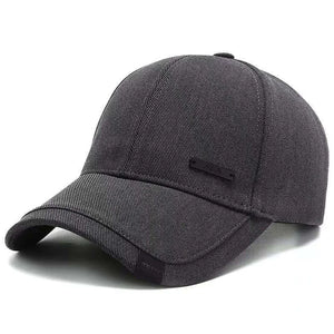 Plain black baseball cap with a small metal tag on the side panel