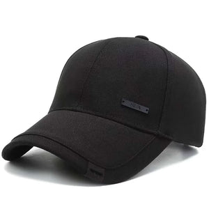 Plain black baseball cap with a small metal tag on the side panel