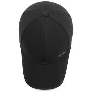Plain black baseball cap with a small metal tag on the side panel