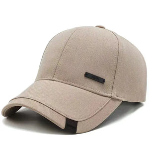 Plain black baseball cap with a small metal tag on the side panel