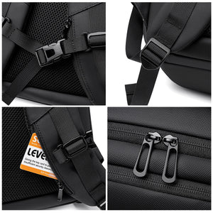 Black business backpack with several separate compartments and a padded back
