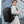 Black business backpack with several separate compartments and a padded back