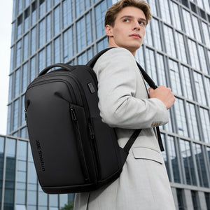 Black business backpack with several separate compartments and a padded back