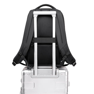 Black business backpack with several separate compartments and a padded back