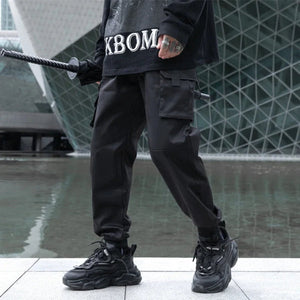 Pantalon noir confortable à revers et poches multiples