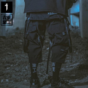 Pantalón negro premium con múltiples bolsillos y diseño patchwork