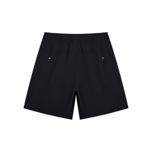 Back of the Black athletic shorts laid flat, back yoke seam and two small light dots at the waist