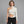 One-Shoulder White Bodysuit – worn by a woman
