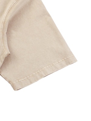 Close-up of the sleeve hem on the Light Apricot acid wash tee, folded edge with a double stitched seam