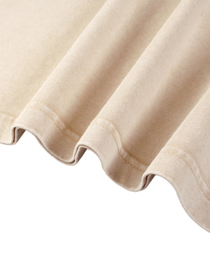 Detail of the bottom hem on the Light Apricot oversized tee, rippled edge with a visible stitched finish