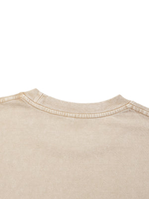 Close-up of the ribbed crew neck on the Light Apricot acid wash tee, showing the faded washed cotton
