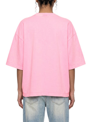 Back view of the Pink oversized tee on a model with light jeans, plain back and dropped shoulder seams