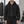 Man wearing the Oversized Black Zip Up Hoodie zipped up outdoors, front view with matching black sweatpants