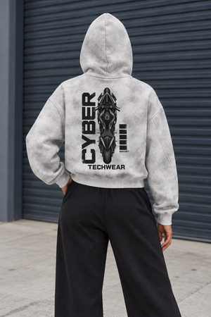 Back of the cropped zip hoodie on the same model, CYBER TECHWEAR motorcycle print across the oversized back