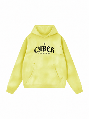 Żółta bluza z efektem wyblakłego słońcem rozłożona płasko, czarny gotycki nadruk CYBER TECHWEAR i małe postrzępione dziury na przodzie