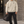 Hanorac grafic streetwear oversized Apricot, logo original negru pe piept, față pe model masculin latino