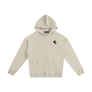 Apricot oversized graphic hoodie laid flat with the hood up, front view of the small black logo and kangaroo pocket