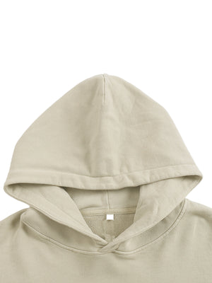Close-up of the Apricot hoodie's lined hood and crossover neckline, showing the soft washed fleece texture